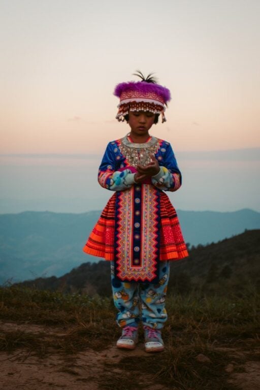 Guide To Phu Chi Fa: Sea Of Mist Viewpoint From Chiang Rai Young girl in traditional mountain clothing in northern thailand