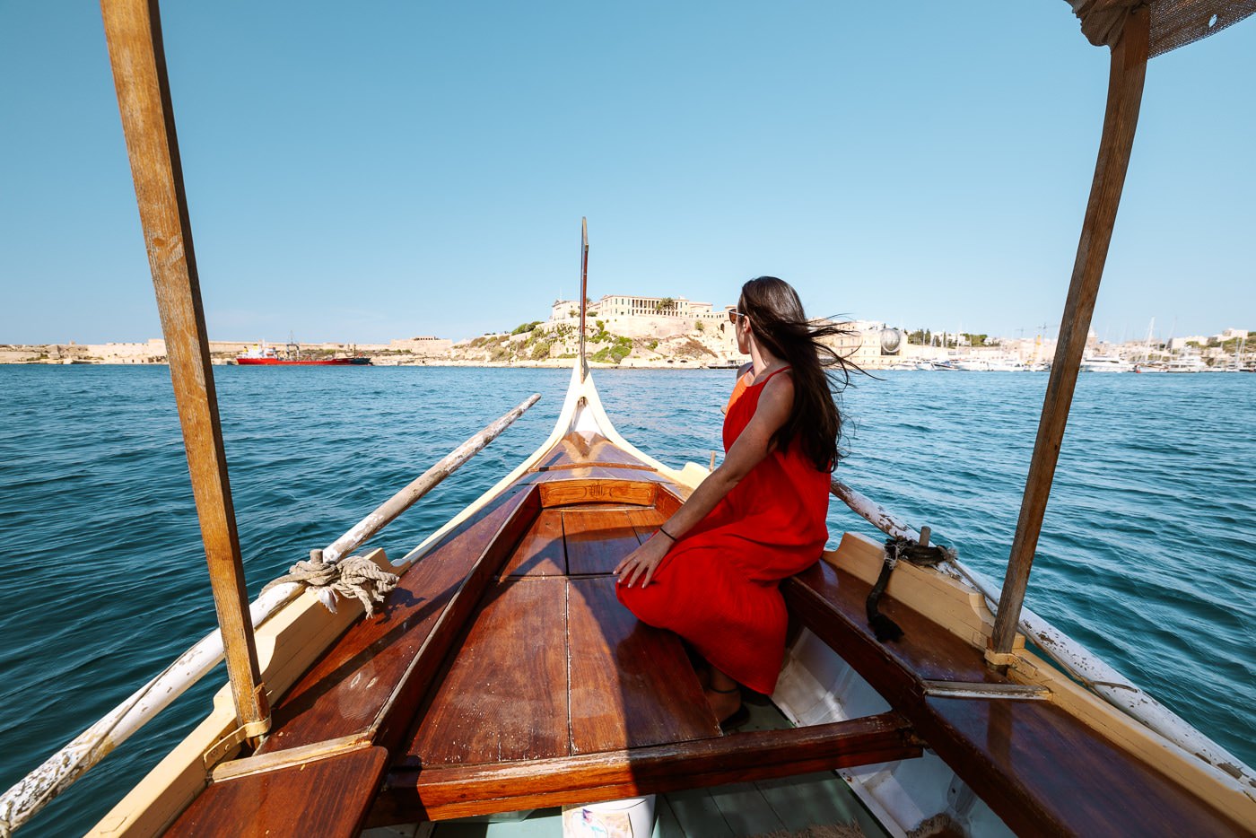 How To Visit The Three Cities Of Malta From Valletta View from the bow of a traditional maltese dgħajsa crossing the grand harbour towards the three cities