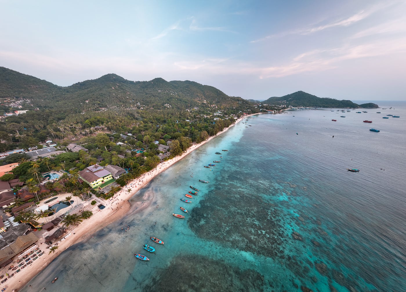 Koh Tao Vs Koh Samui: Which Island Should You Pick? Aerial view of sairee beach and its longtail boats on koh tao