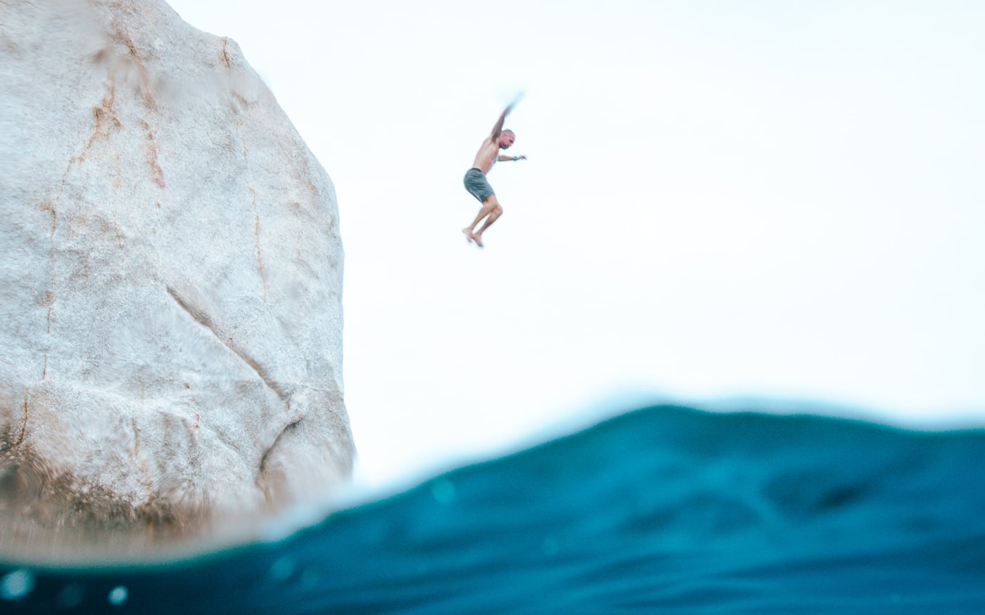 Koh Tao Vs Koh Samui: Which Island Should You Pick? Swimmer jumping from the rock in the middle of tanote bay, koh tao