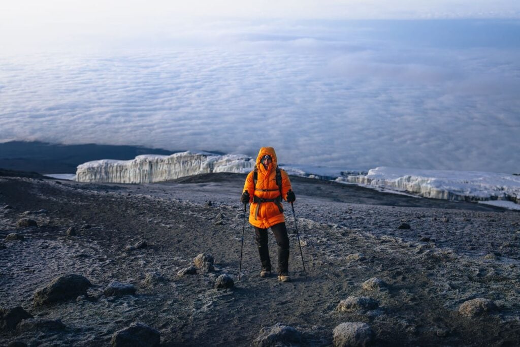 Trekker on top of Kilimanjaro summit