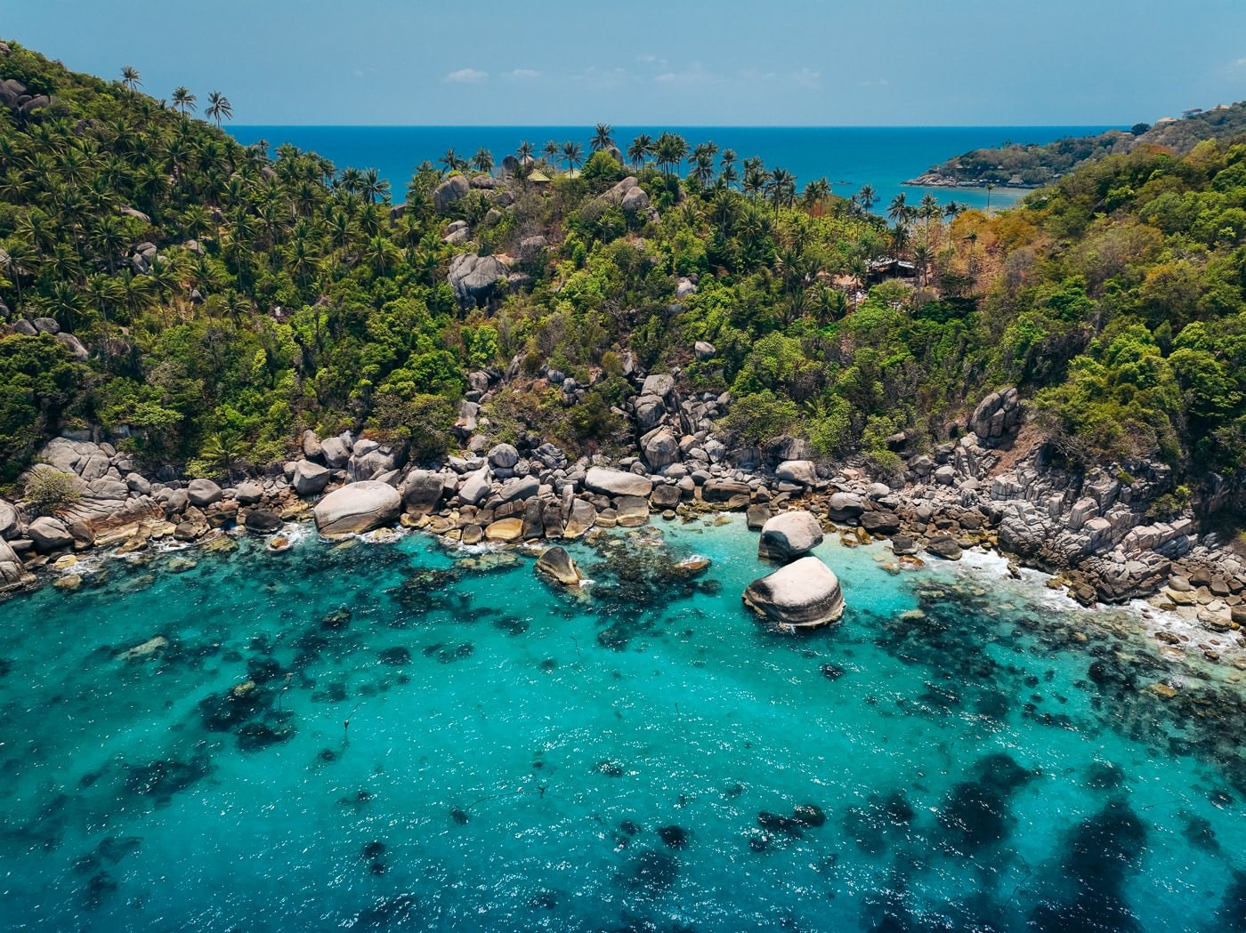 Koh Tao Vs Koh Samui: Which Island Should You Pick? Clear shallow water and reef at shark bay on the southeast coast of koh tao