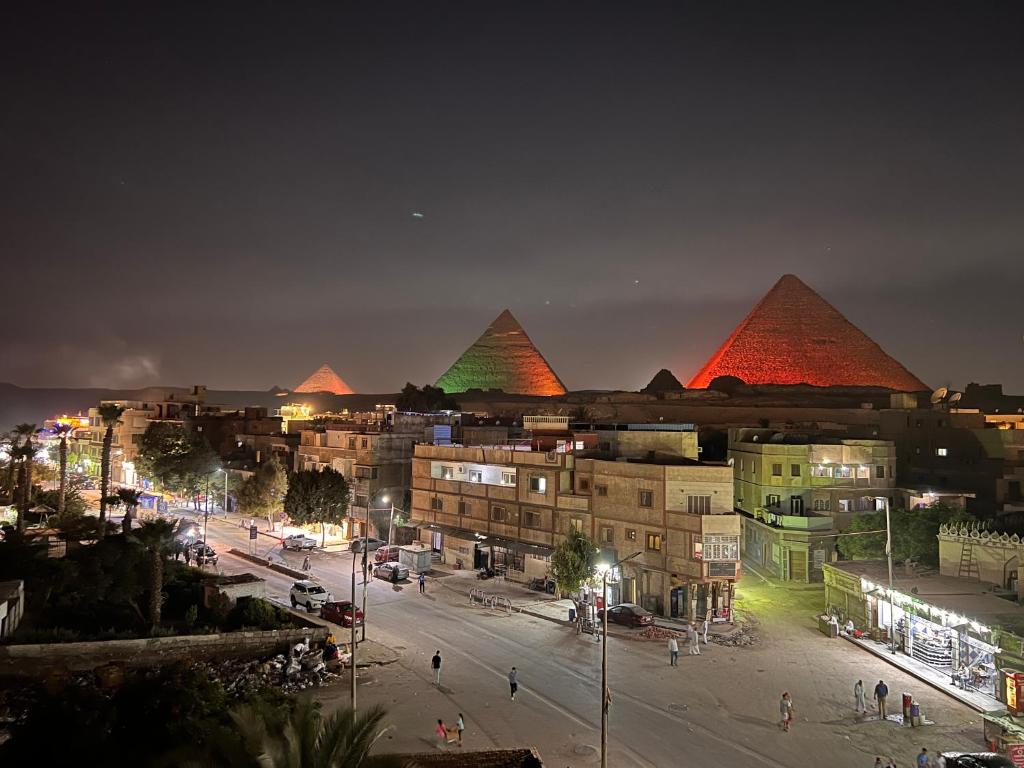 12 Of My Favorite Giza &Amp; Cairo Hotels With Pyramid Views Night view of the pyramids from nut pyramids inn