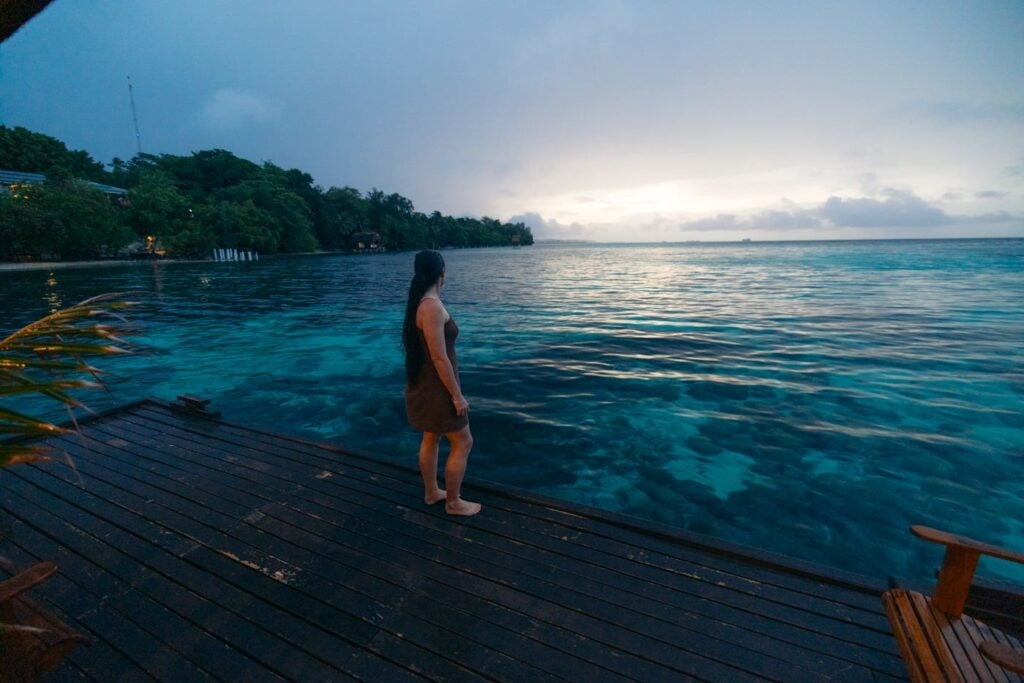 Fatboys Resort Review: My Honest Take After Visiting Girl standing at sunset jetty at fatboys resort