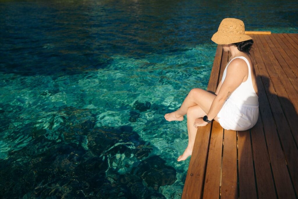 Fatboys Resort Review: My Honest Take After Visiting Girl sitting at the jetty of fatboys resort