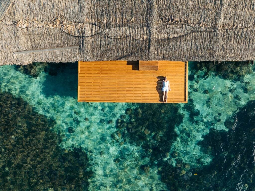 Fatboys Resort Review: My Honest Take After Visiting Girl sitting on the jetty of fatboys resort
