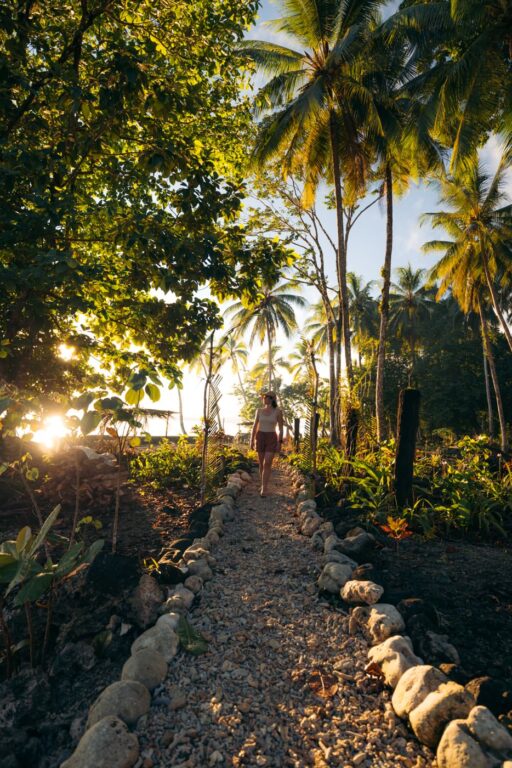Girl walking through Titiru Eco Lodge in the Solomon Islands