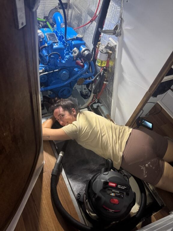 About Olly Gaspar &Amp; We Seek Travel Girl working on a boat engine
