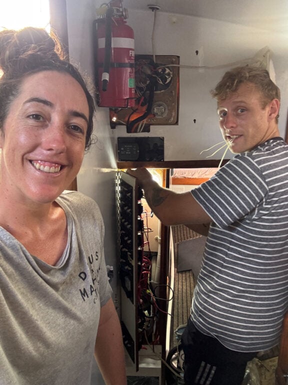 About Olly Gaspar &Amp; We Seek Travel Olly and haylea doing electrical work on their boat
