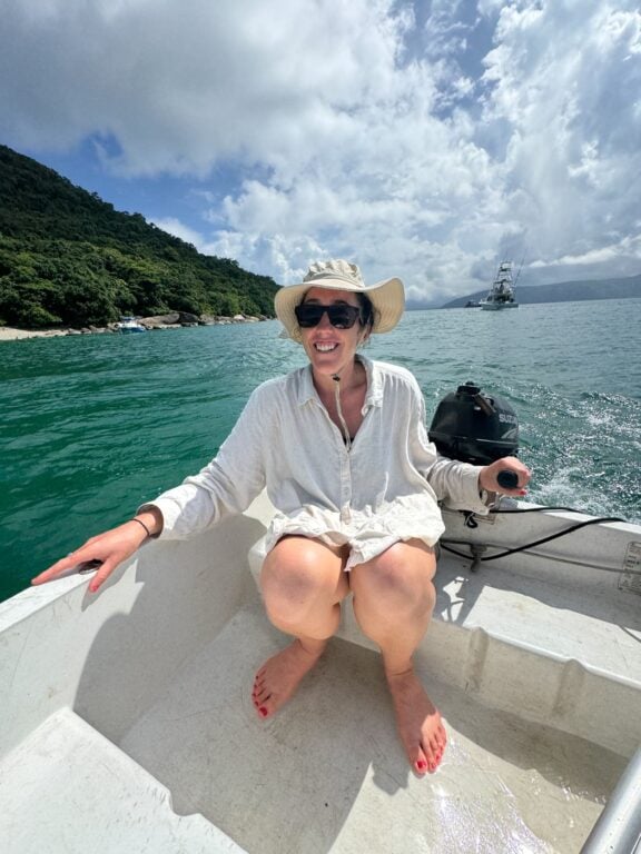 About Olly Gaspar &Amp; We Seek Travel Haylea driving a small boat