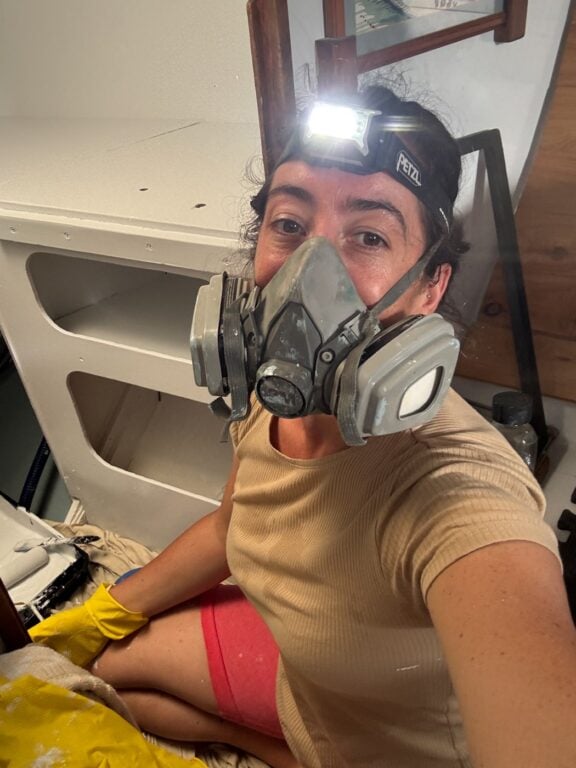 About Olly Gaspar &Amp; We Seek Travel Haylea painting with a mask