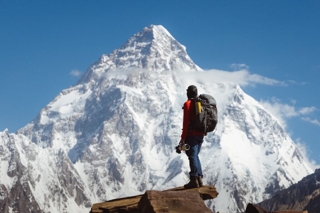 Olly Gaspar wearing the Atlas Adventure Travel Photography Backpack in Pakistan mountains