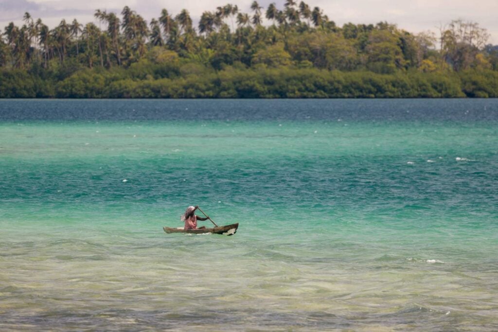 Solomon Islands Eco Lodges &Amp; Dive Resorts Guide Dug out canoe paddler in the solomon islands