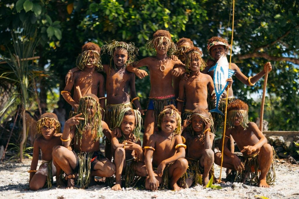 Group of young Solomon Islander boys displaying a cultural show