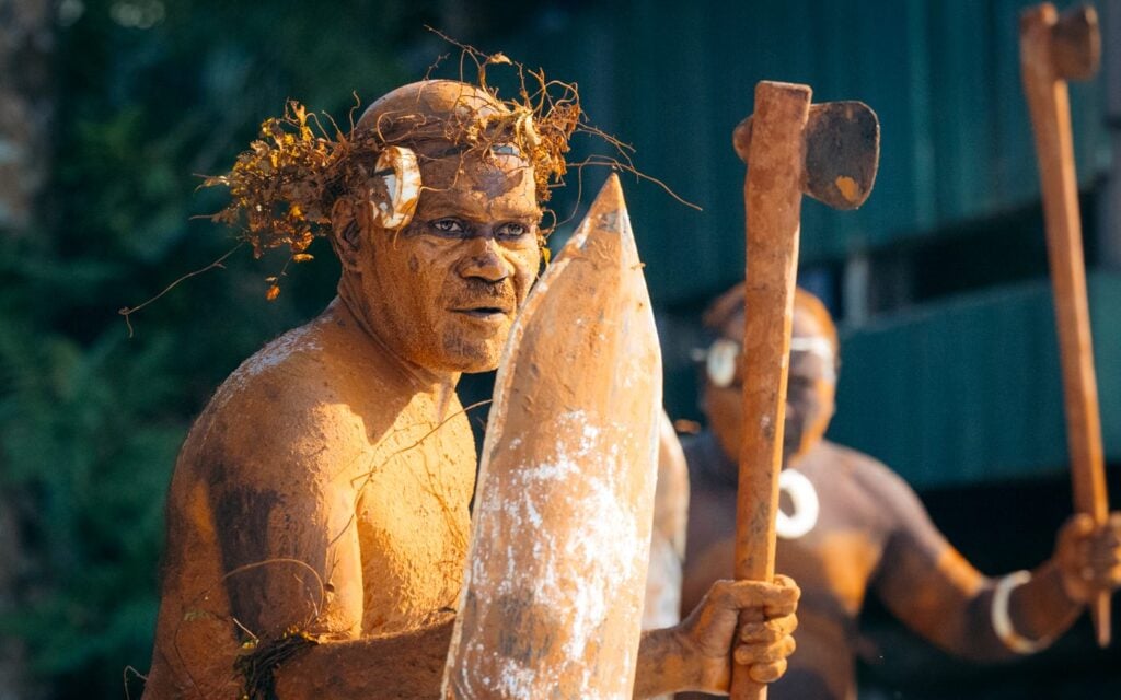 Solomon Islander in traditional warrior costume demonstration