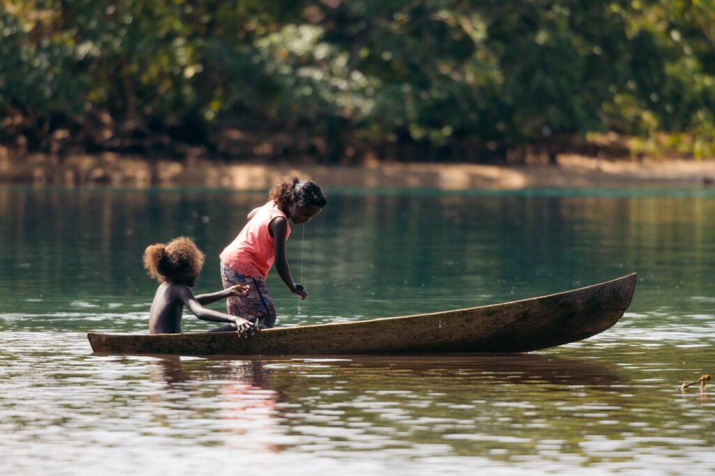 Kids fisihing in Ughele Village, Solomon Islands