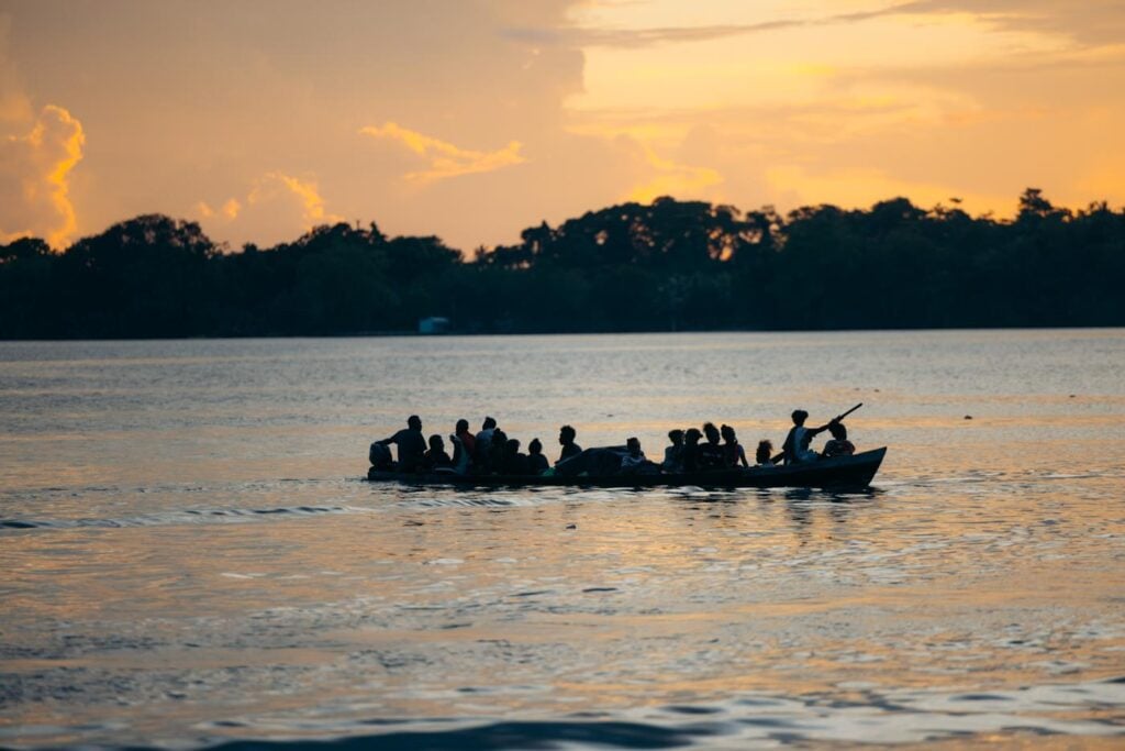 Solomon Islands Eco Lodges &Amp; Dive Resorts Guide Villagers paddling in munda, solomon islands