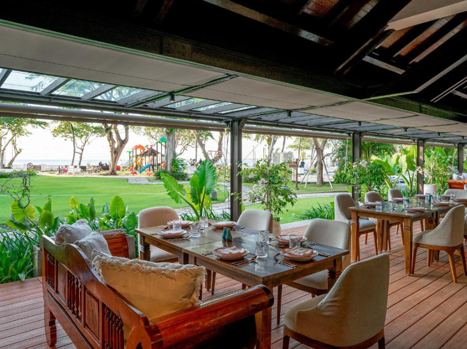 Outdoor dining and playground at discovery kartika in bali